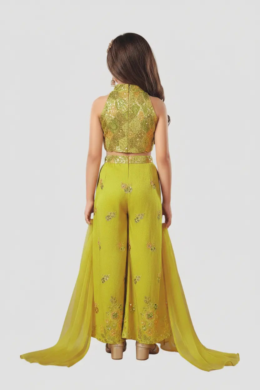 Woman wearing a yellow embroidered outfit on a white background