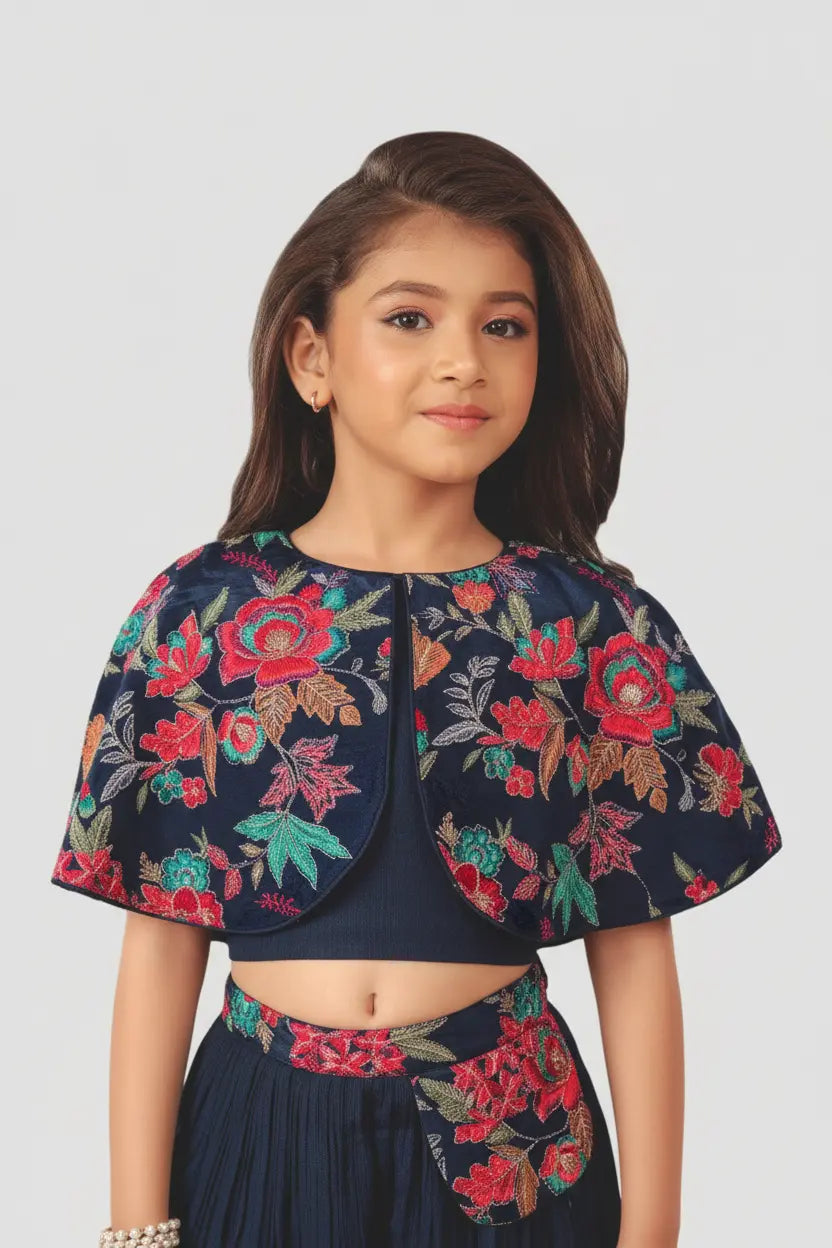 Young girl wearing a floral embroidered outfit on a white background