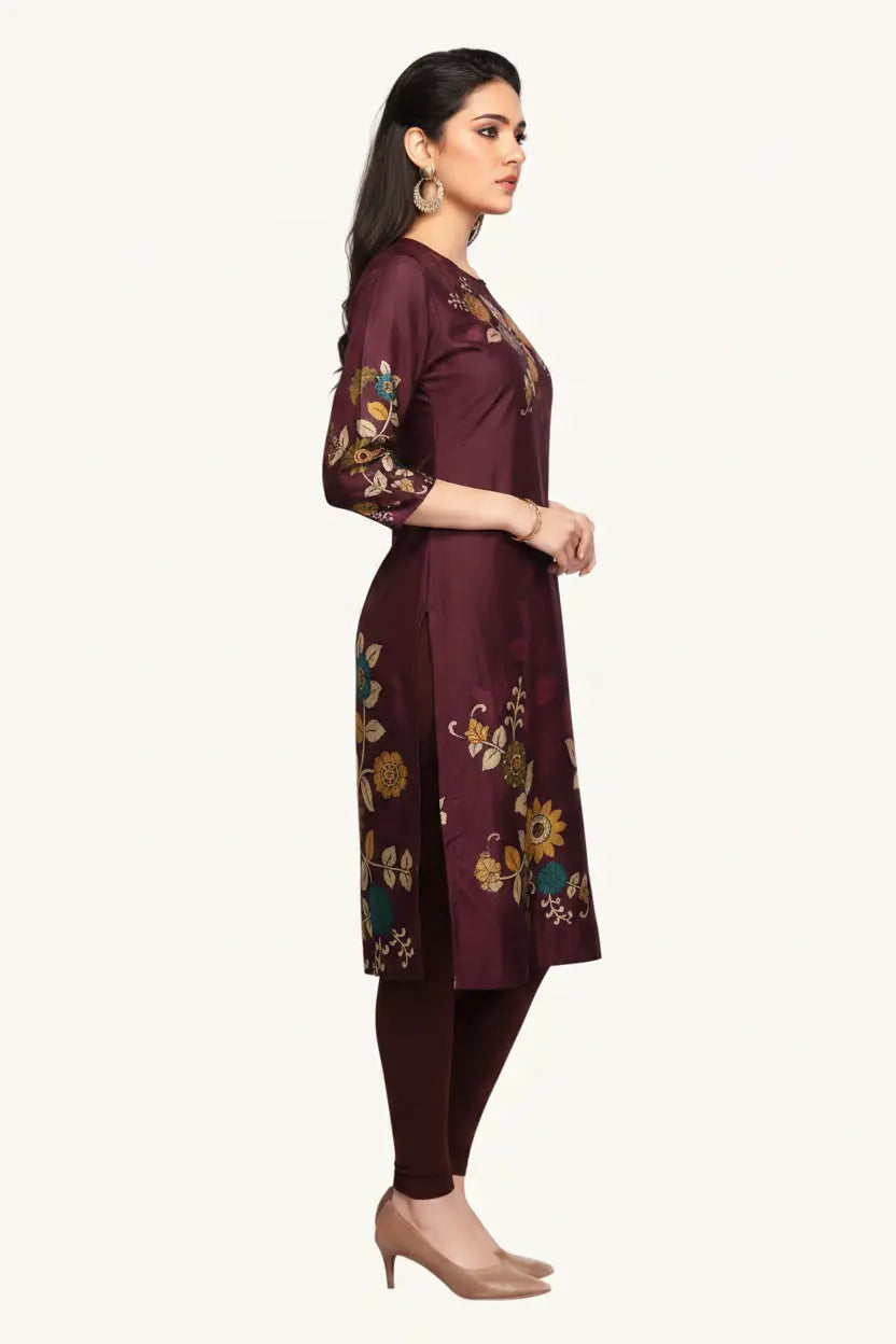 Woman wearing a maroon kurta with floral patterns on a white background