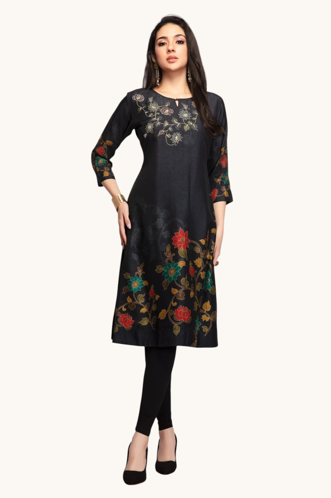Woman wearing a black floral embroidered kurta on a white background