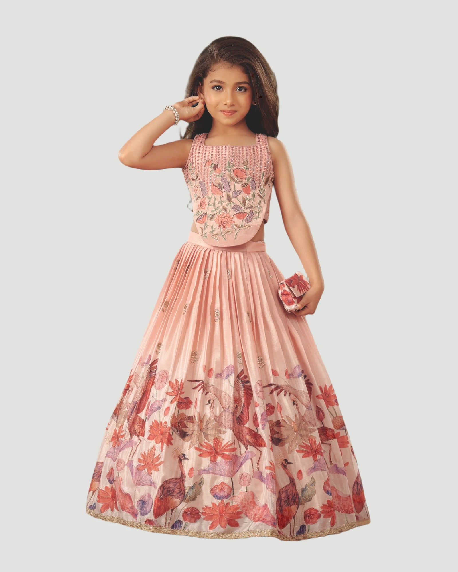 Young girl wearing a floral dress on a white background