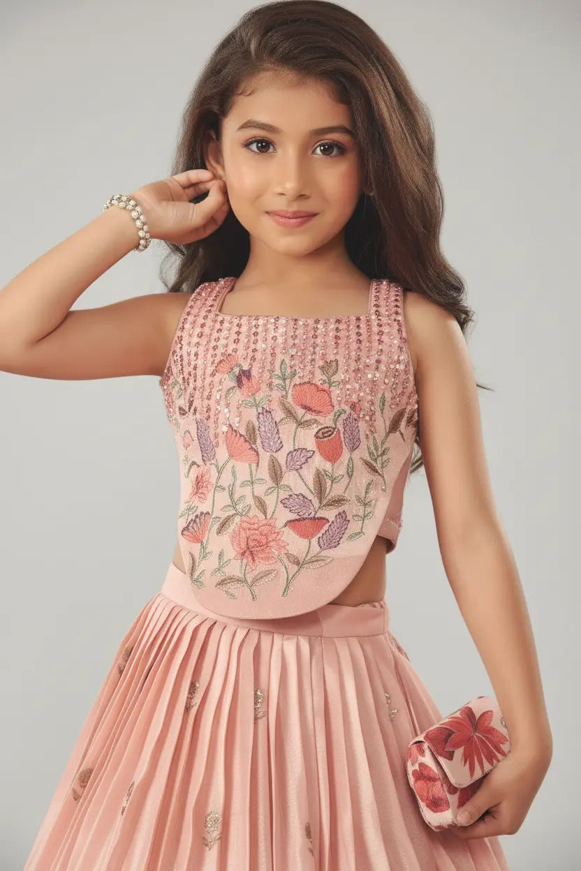 Young girl in a pink floral dress with a gray background