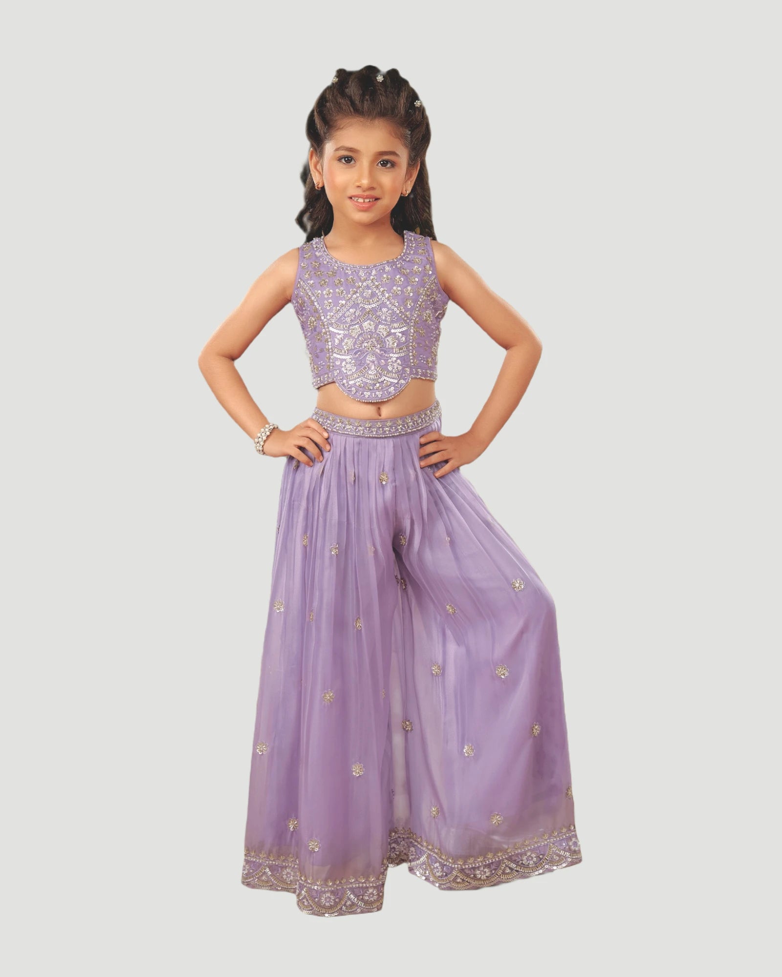 Young girl wearing a purple traditional outfit on a white background