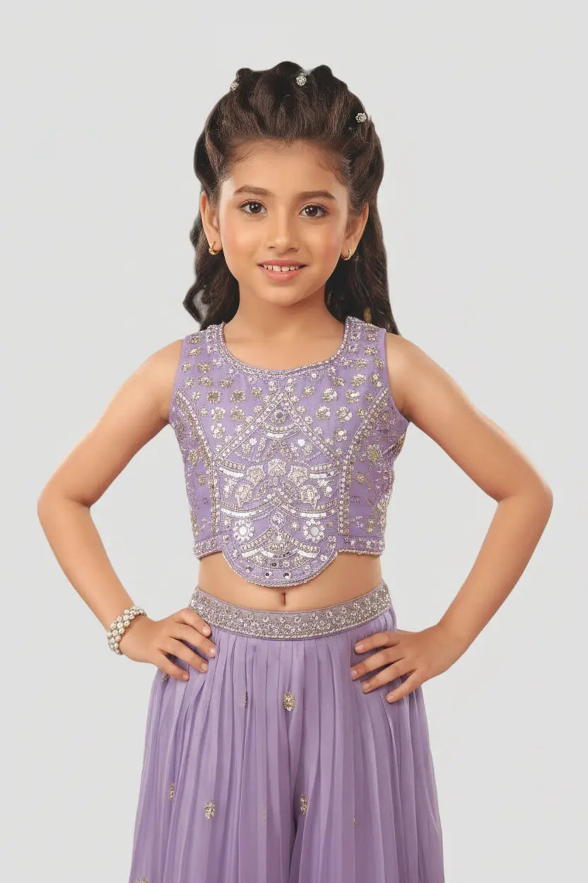 Young girl wearing a purple traditional outfit with intricate designs on a light gray background