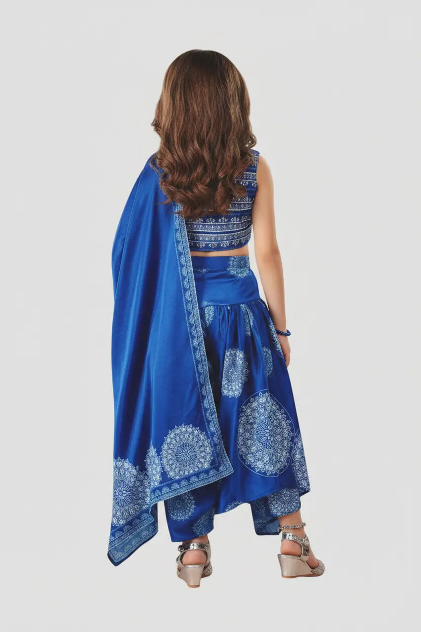 Woman wearing a blue traditional outfit with a matching dupatta on a white background