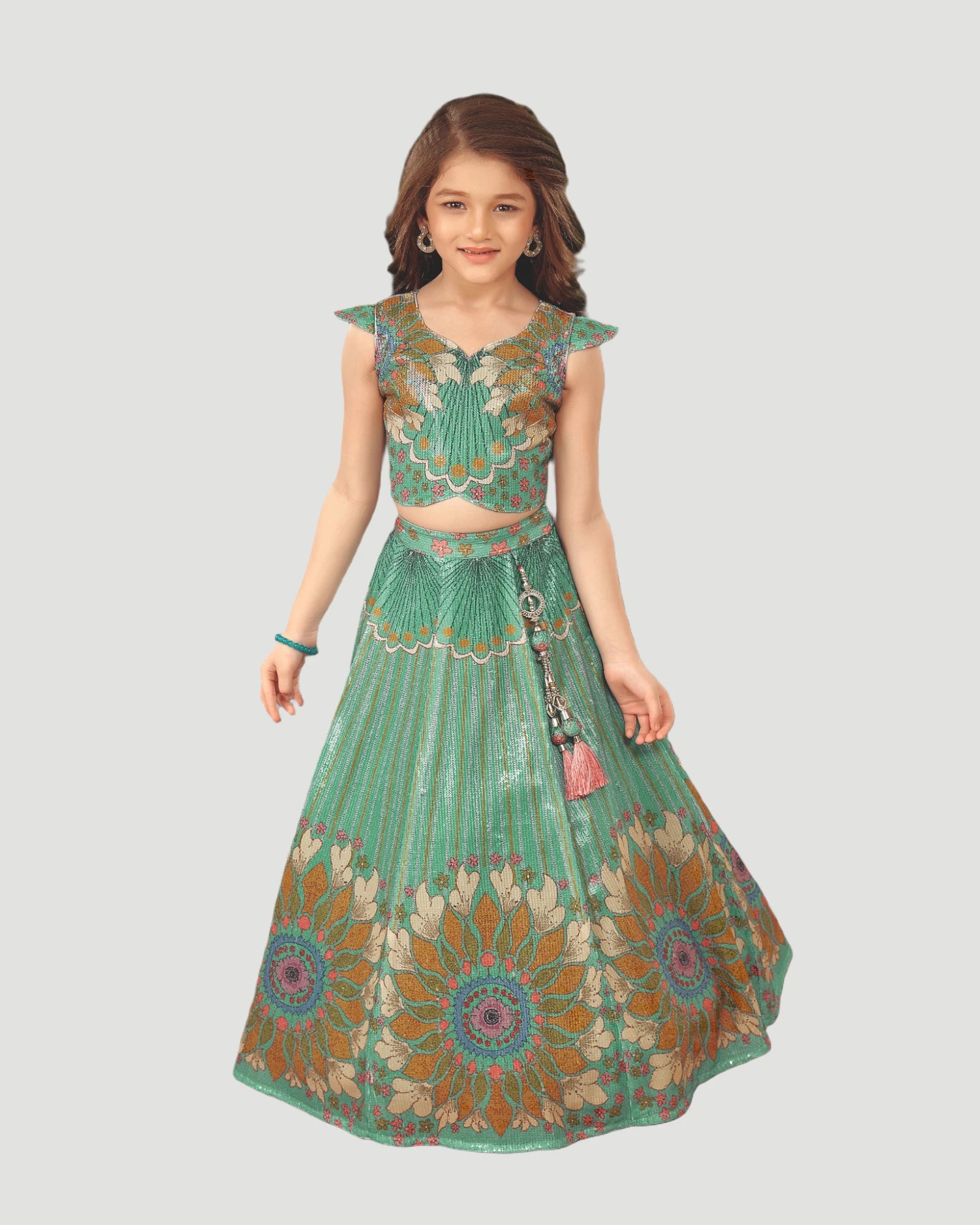 Green embroidered traditional outfit on a white background