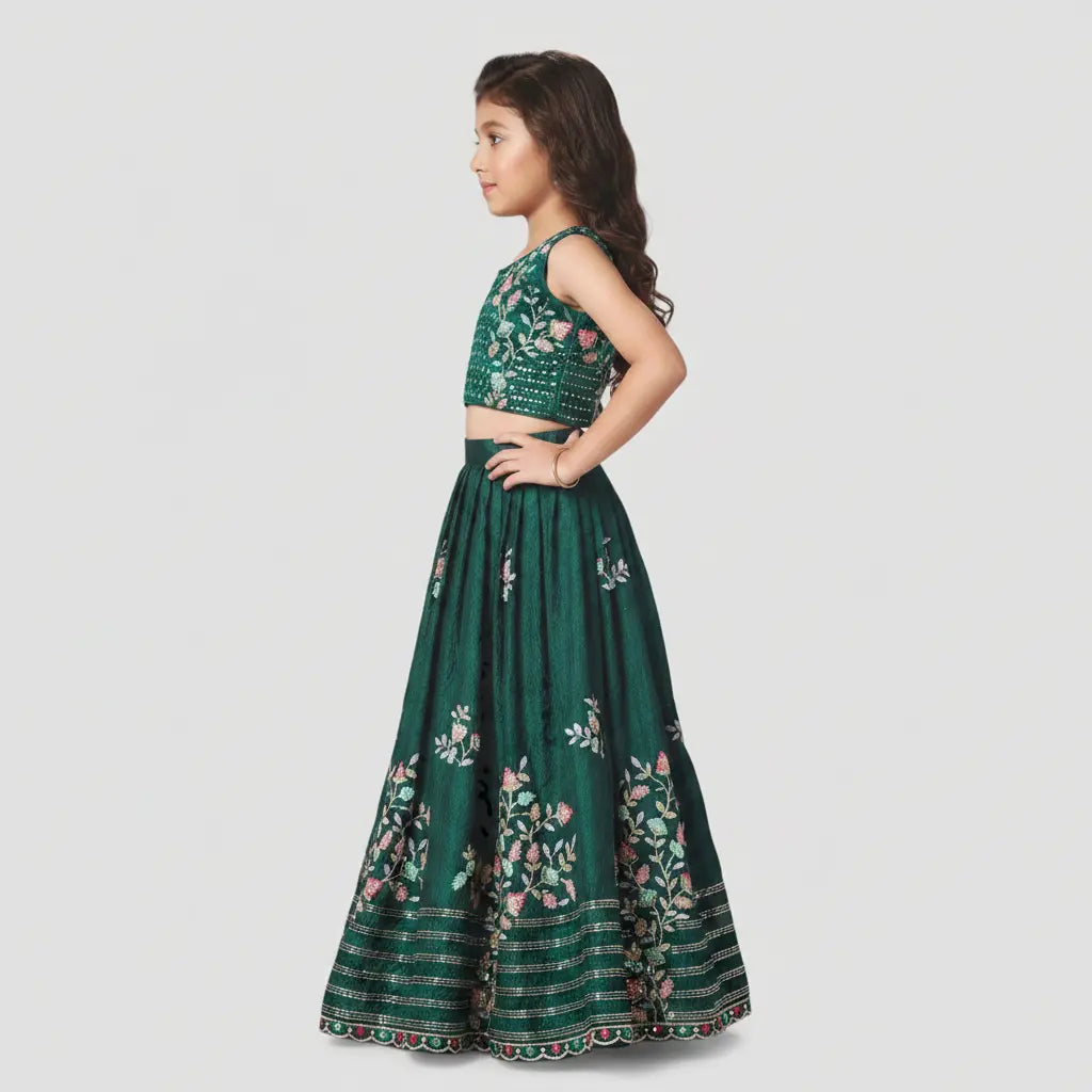 Green floral dress worn by a model on a light gray background