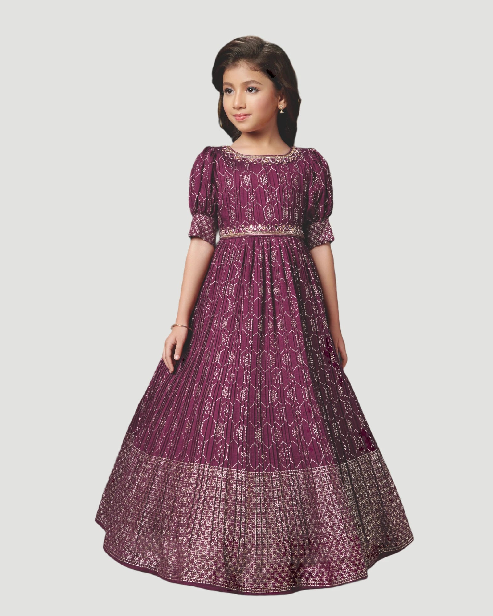 Girl wearing a long purple dress with pattern on a white background