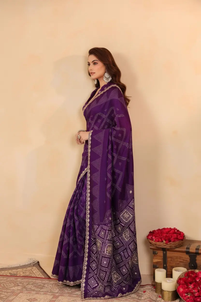 Woman wearing a purple saree with a beige background
