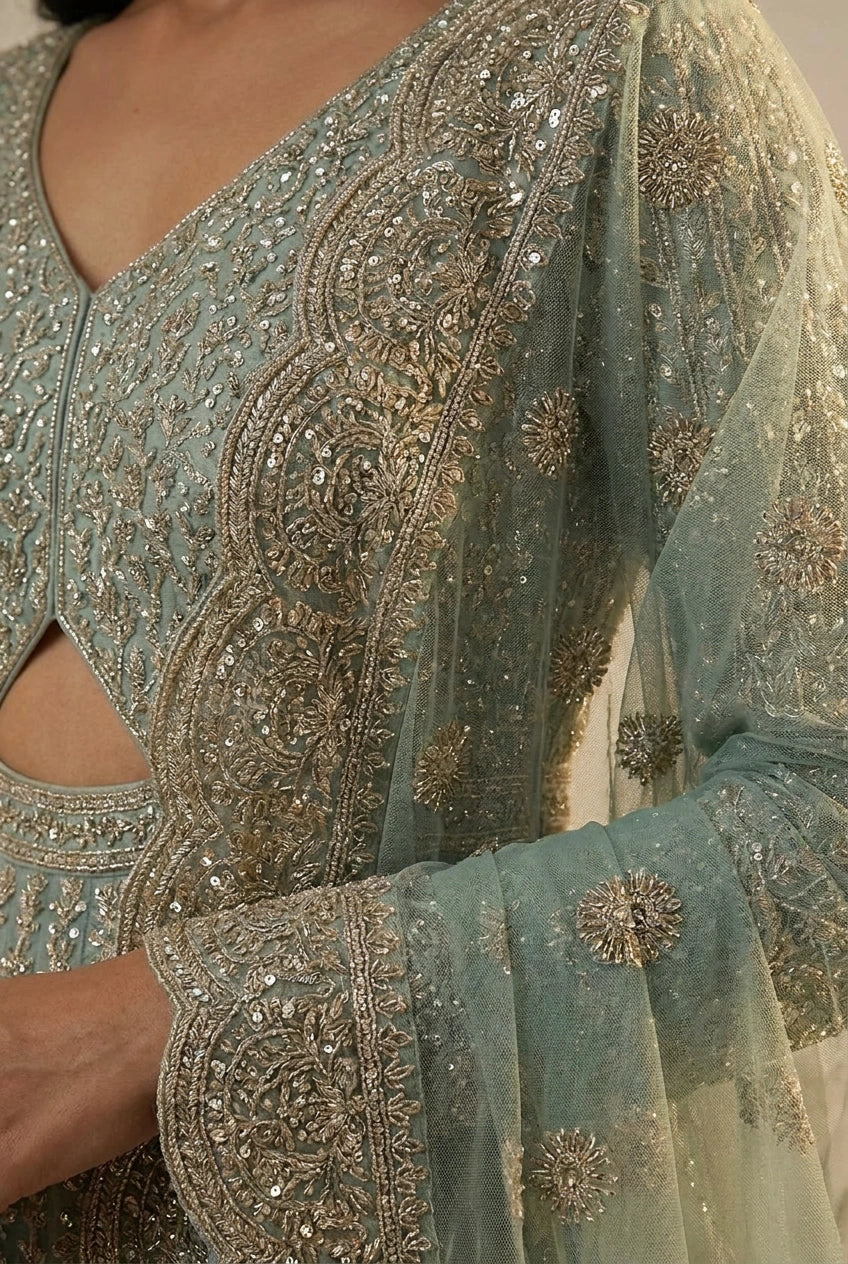 Light blue embroidered dress with intricate patterns and embellishments.