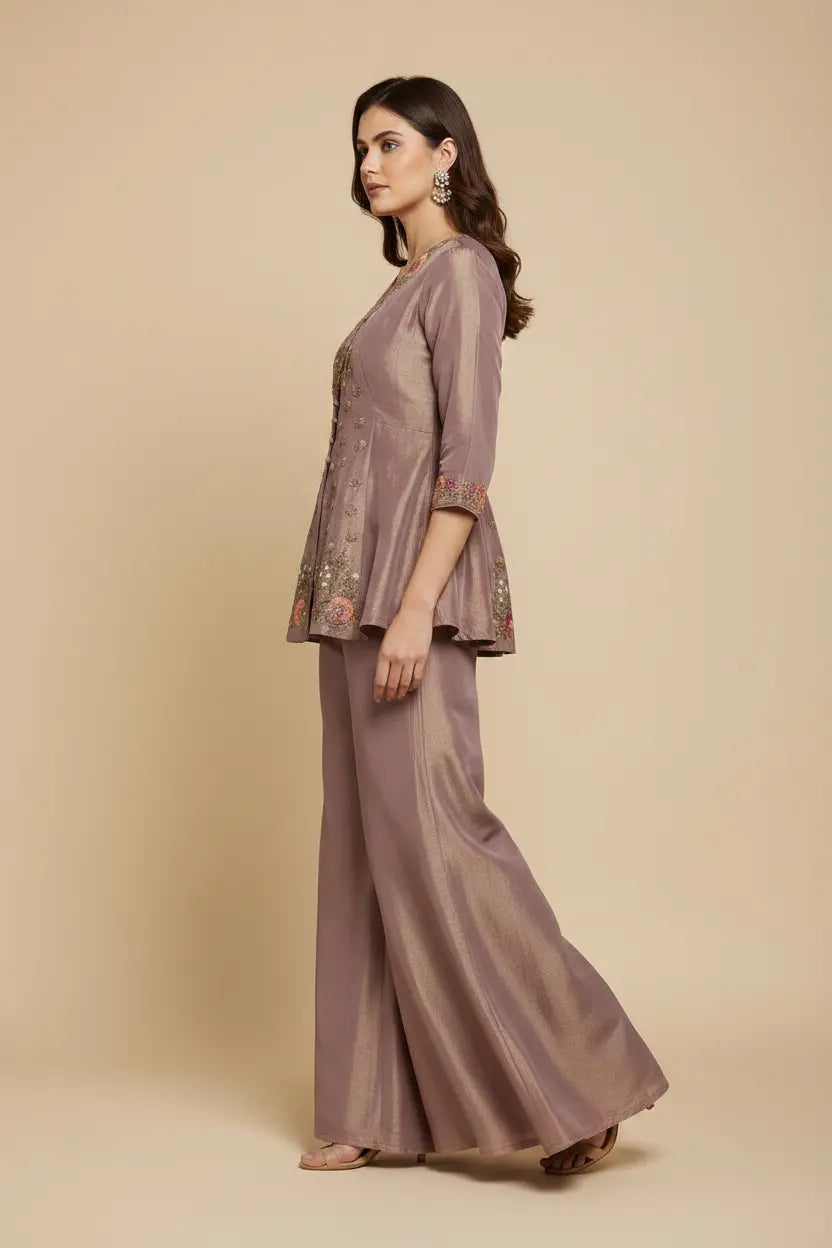 Woman wearing a matching two-piece outfit with a beige background