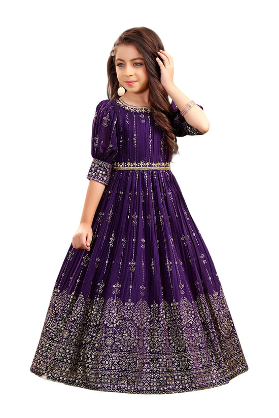 Purple embroidered dress worn by a model on a white background
