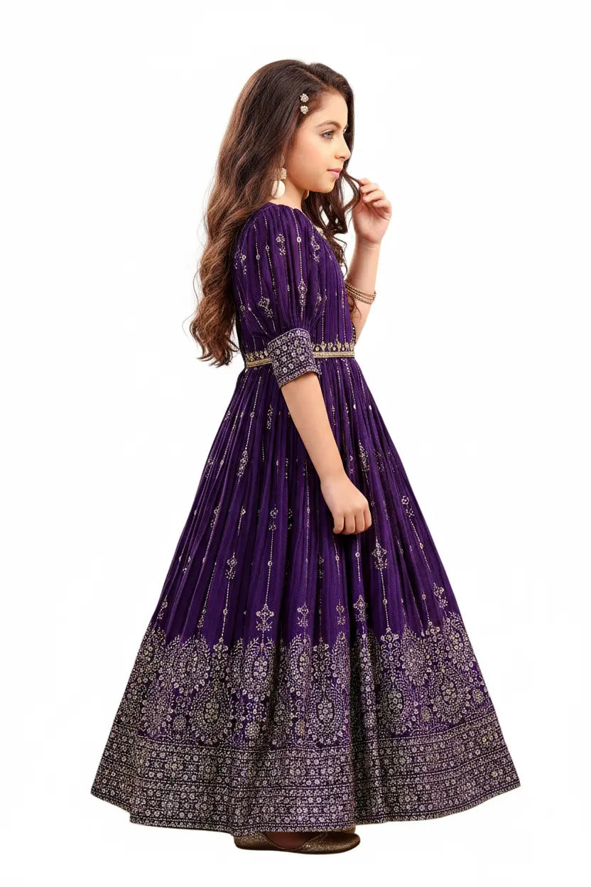 Woman wearing a purple traditional dress with intricate patterns on a white background