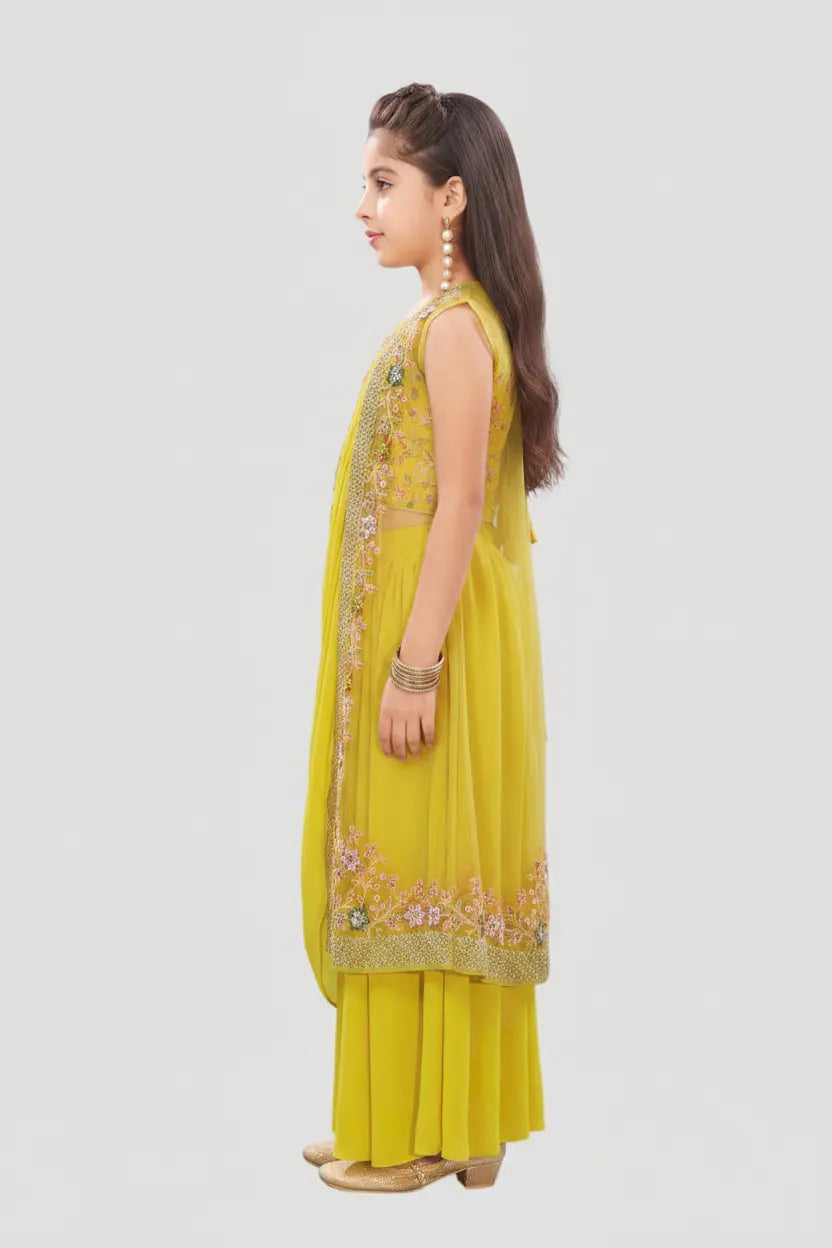 Woman wearing a yellow traditional outfit with floral embroidery on a white background