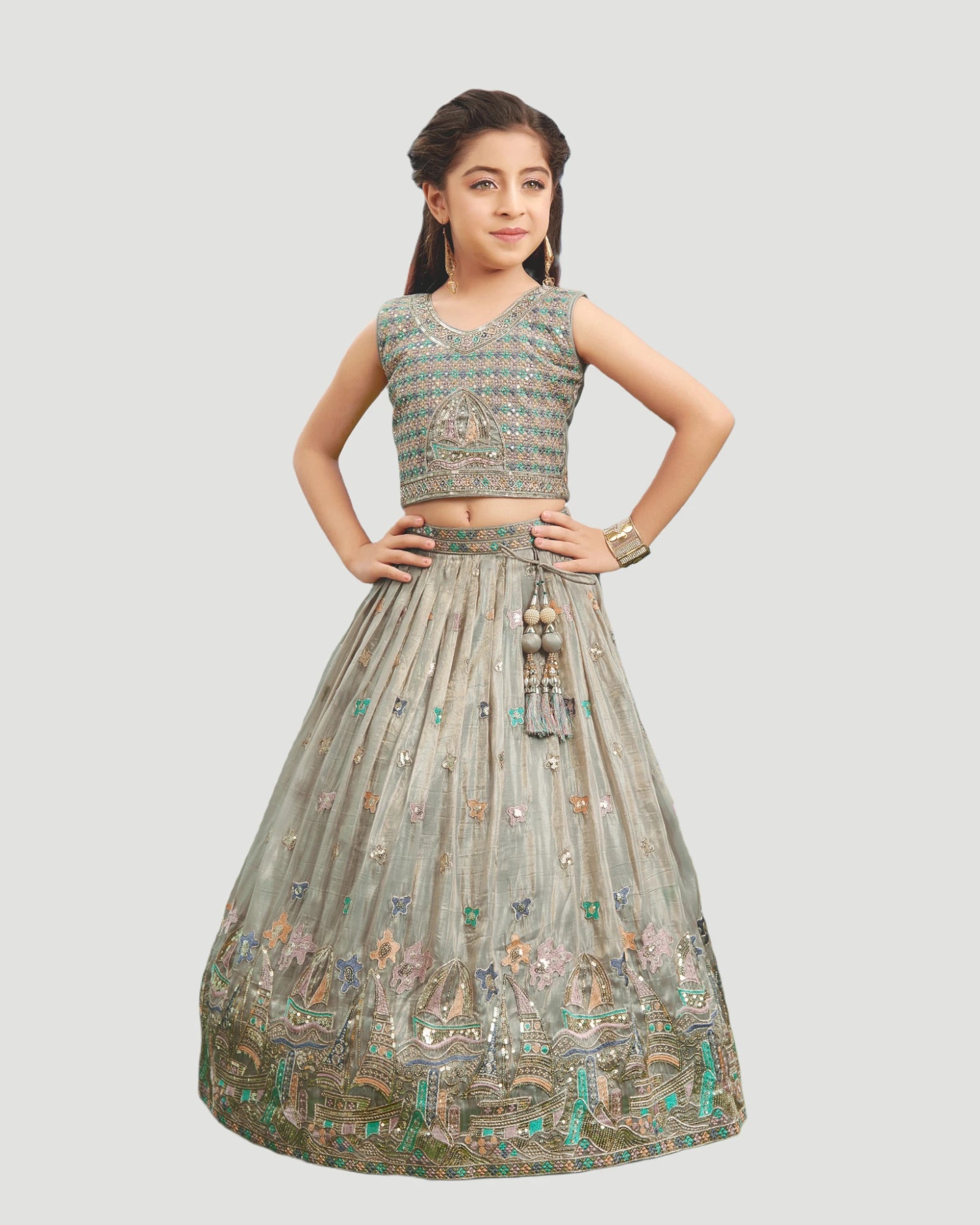 Young girl wearing a traditional embroidered outfit on a light gray background