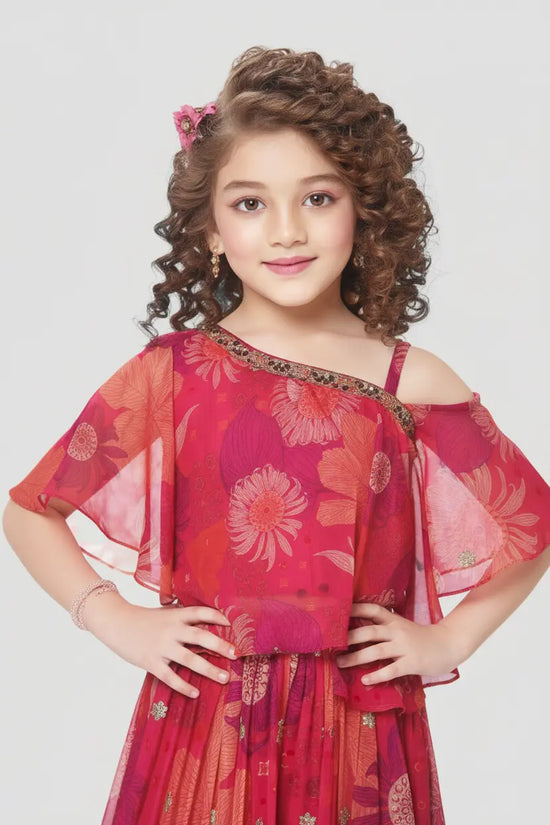 Young girl wearing a red floral dress against a white background