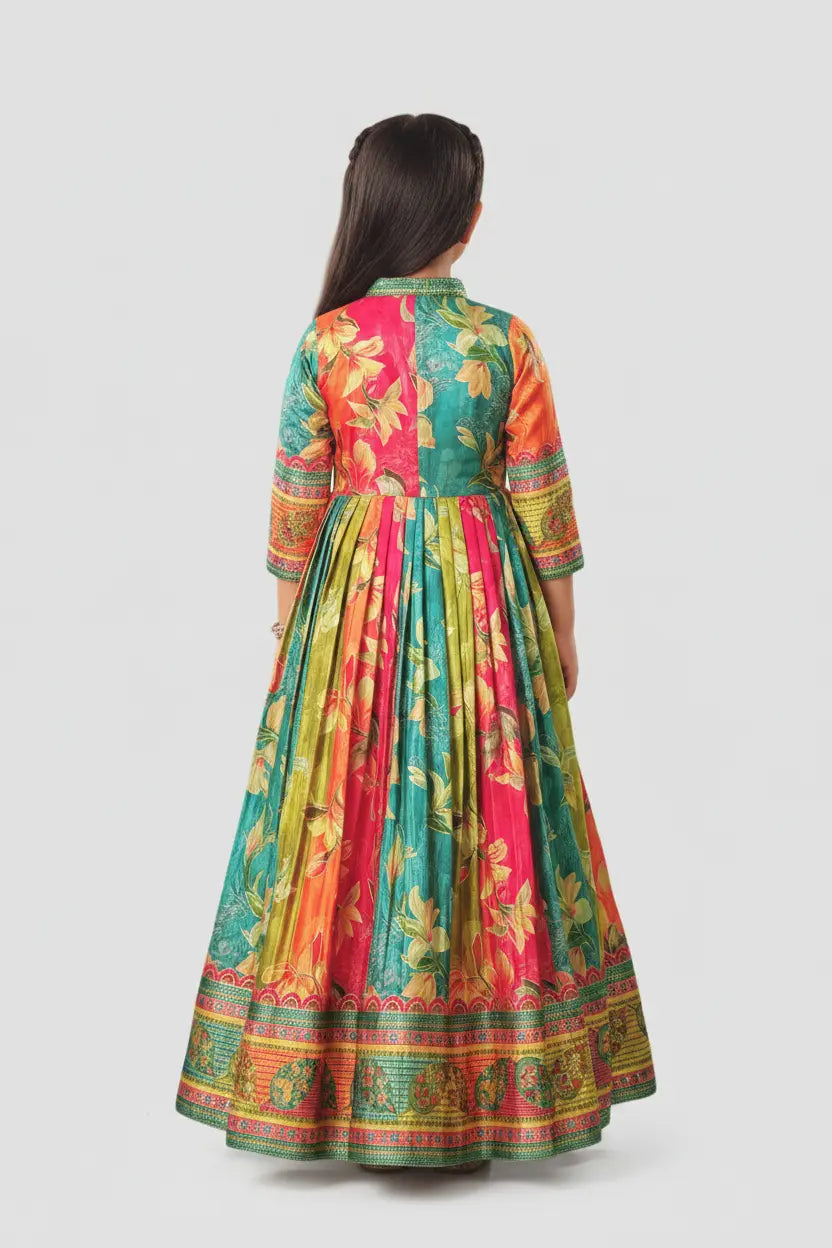 Woman wearing a colorful floral dress on a white background