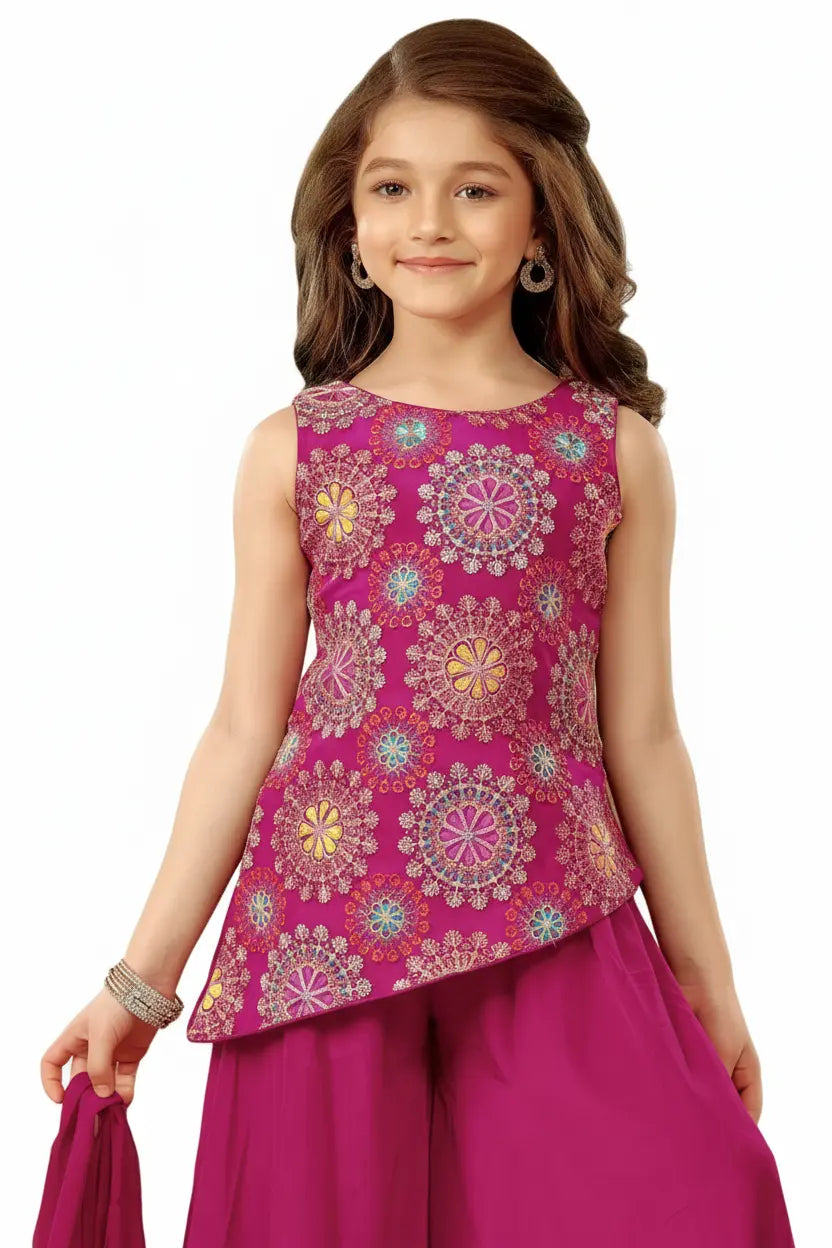 Young girl wearing a pink floral top and pink pants on a white background