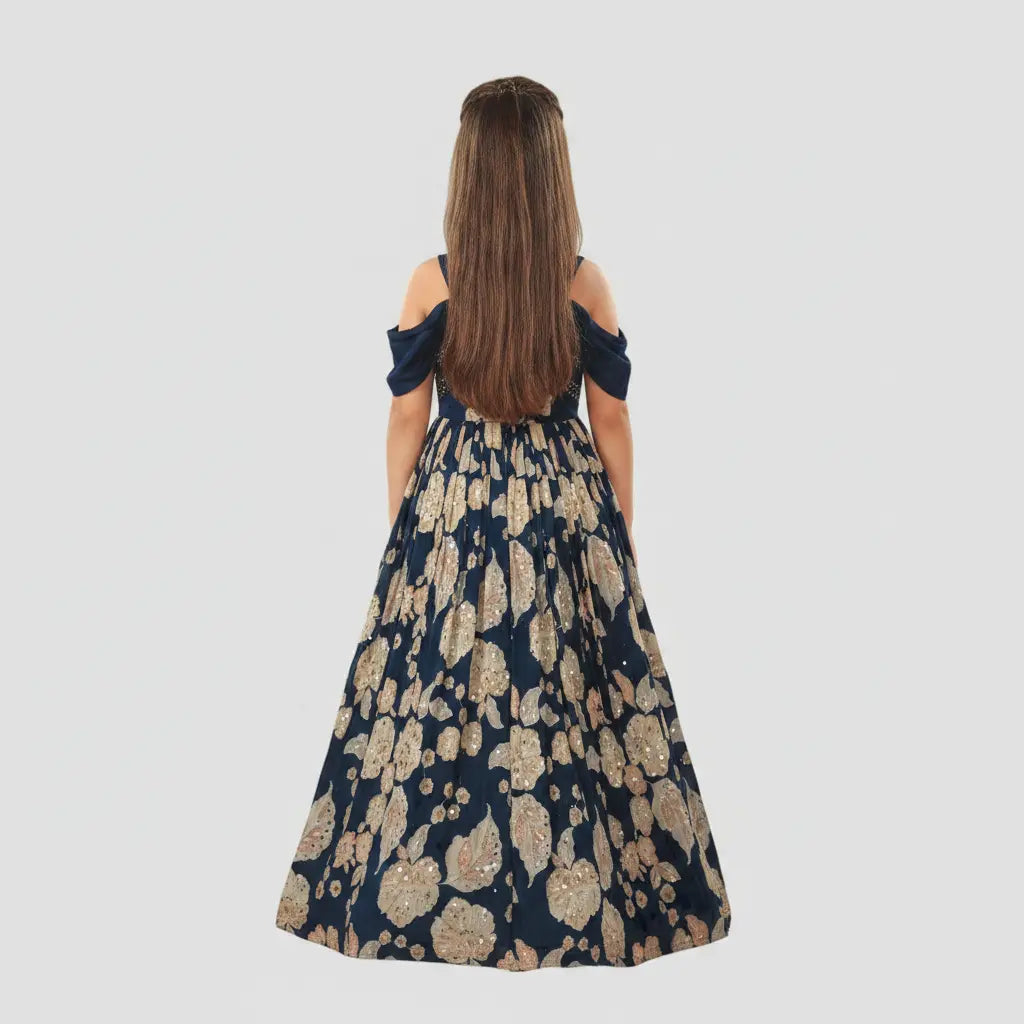 Woman wearing a floral off-shoulder dress on a plain background