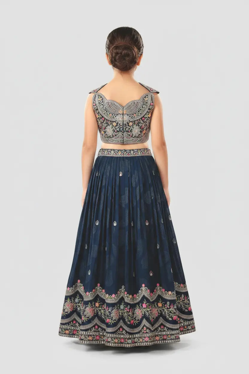 Navy blue embroidered traditional gown with matching top on a white background