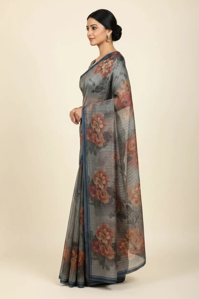 Woman wearing a floral saree with a plain background