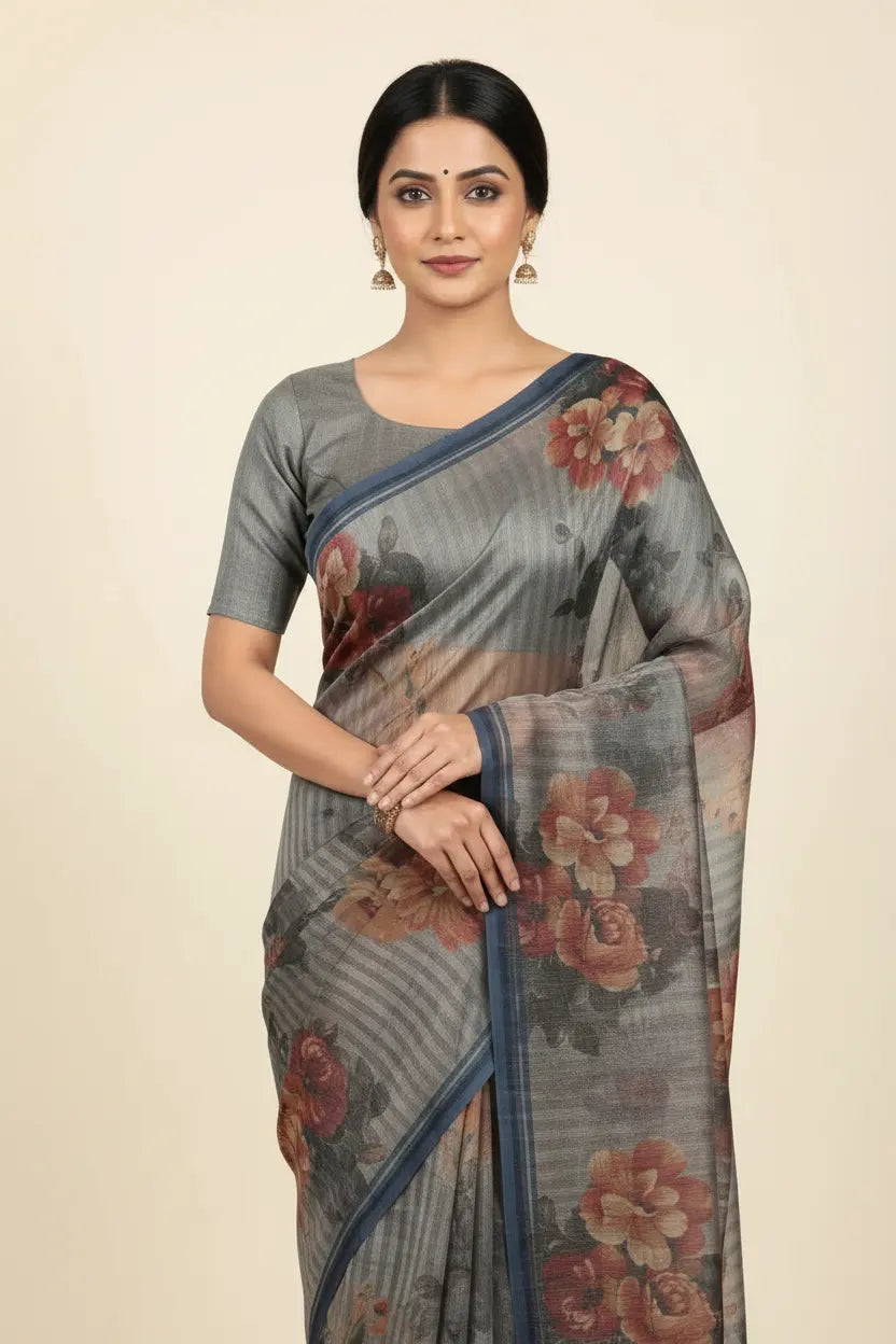 Woman wearing a floral saree with a plain background