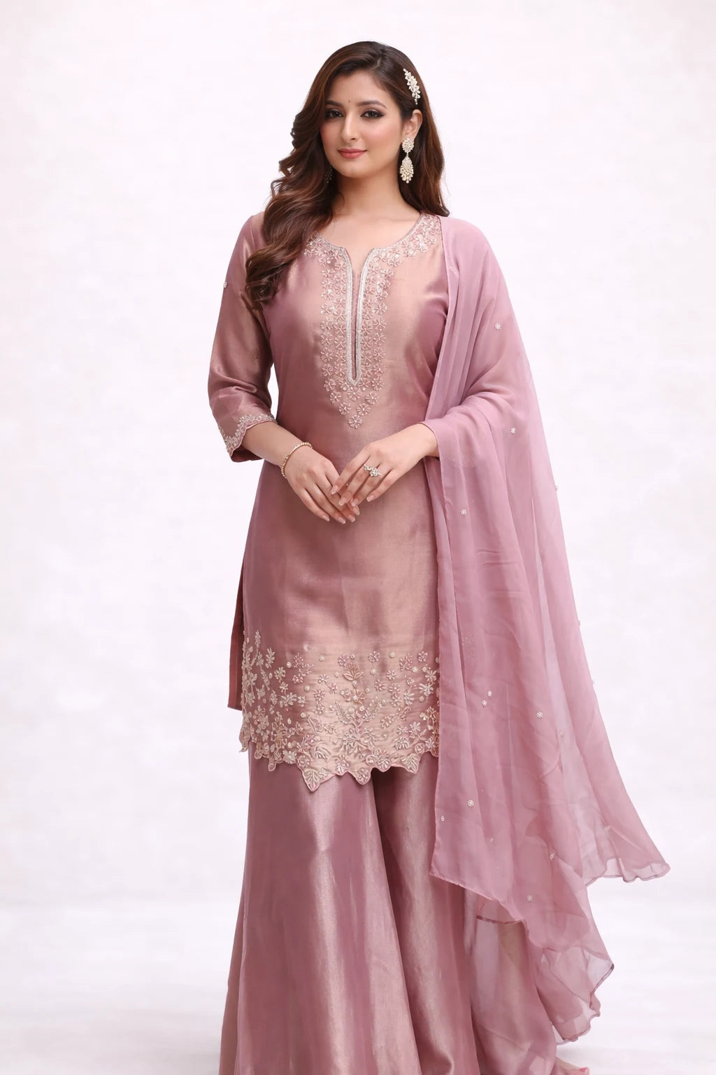 Pink traditional outfit with embroidery on a white background