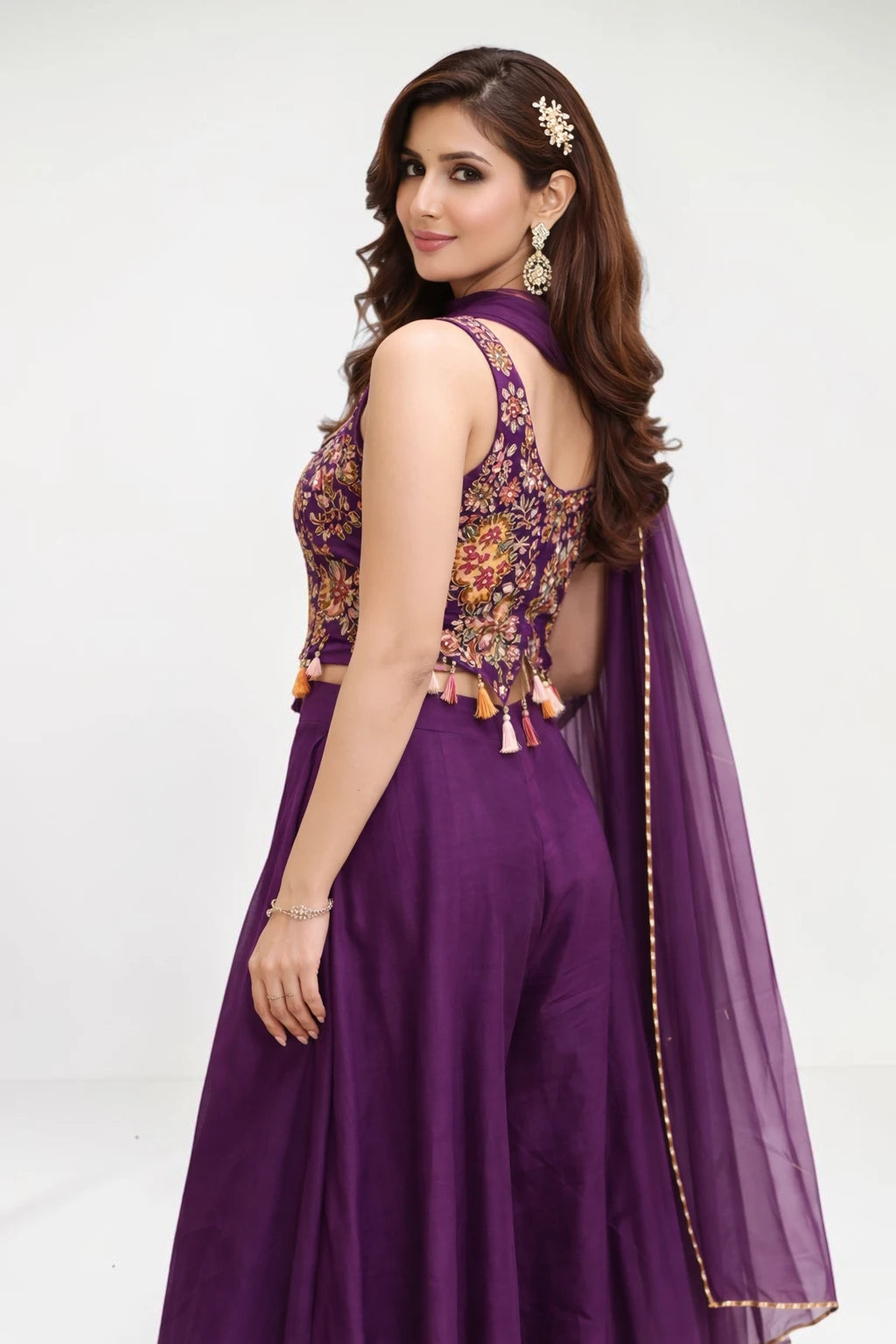 Woman wearing a purple traditional outfit with floral patterns on a white background