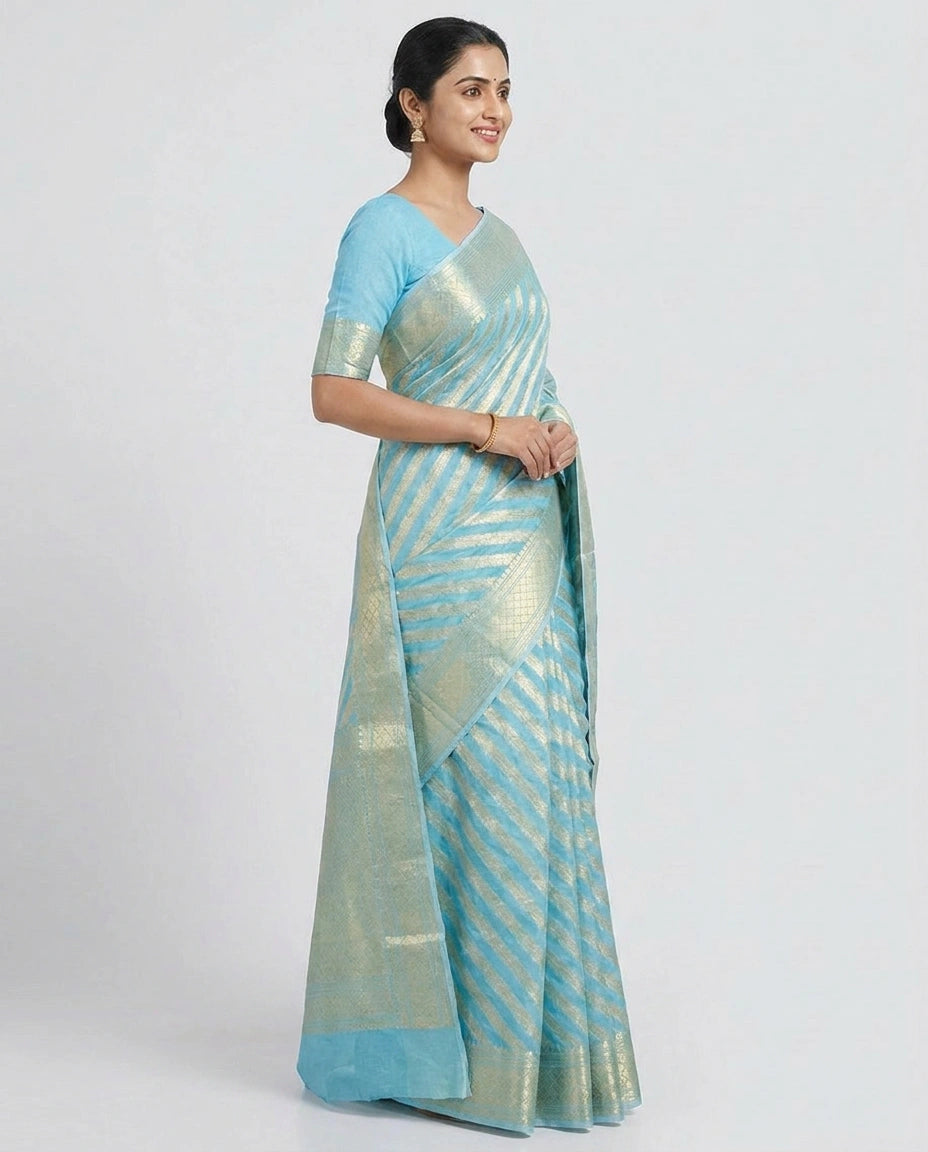 Woman wearing a light blue saree with a white background