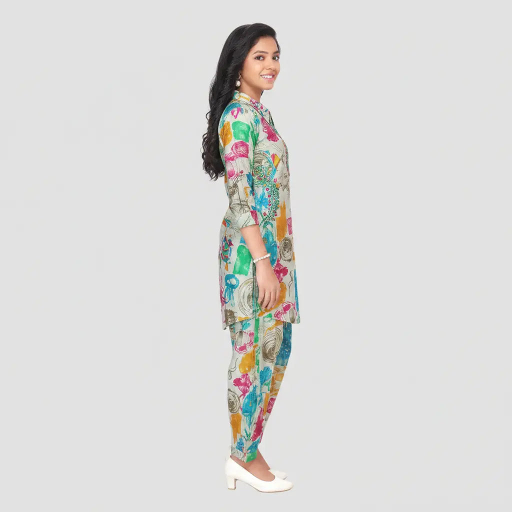Woman wearing a colorful floral outfit on a light gray background