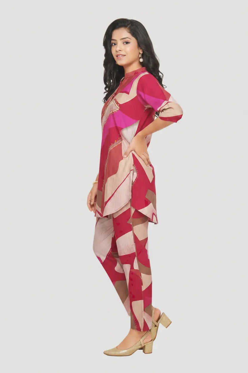 Woman wearing a pink and red patterned outfit on a white background