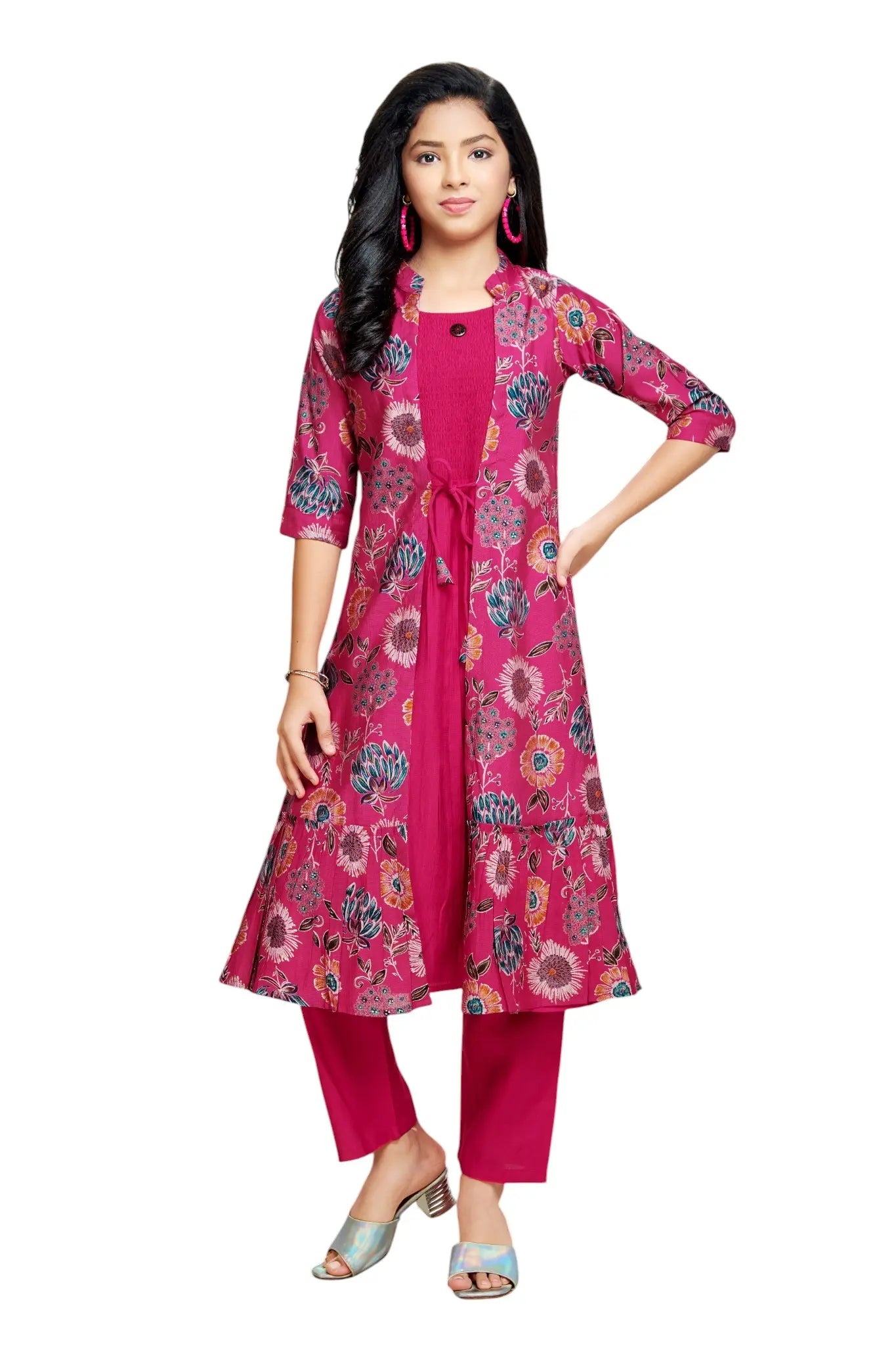 Woman wearing a pink floral kurta with matching pants on a white background