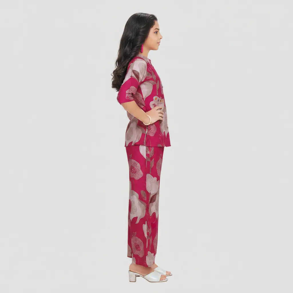 Woman wearing a pink floral outfit on a white background