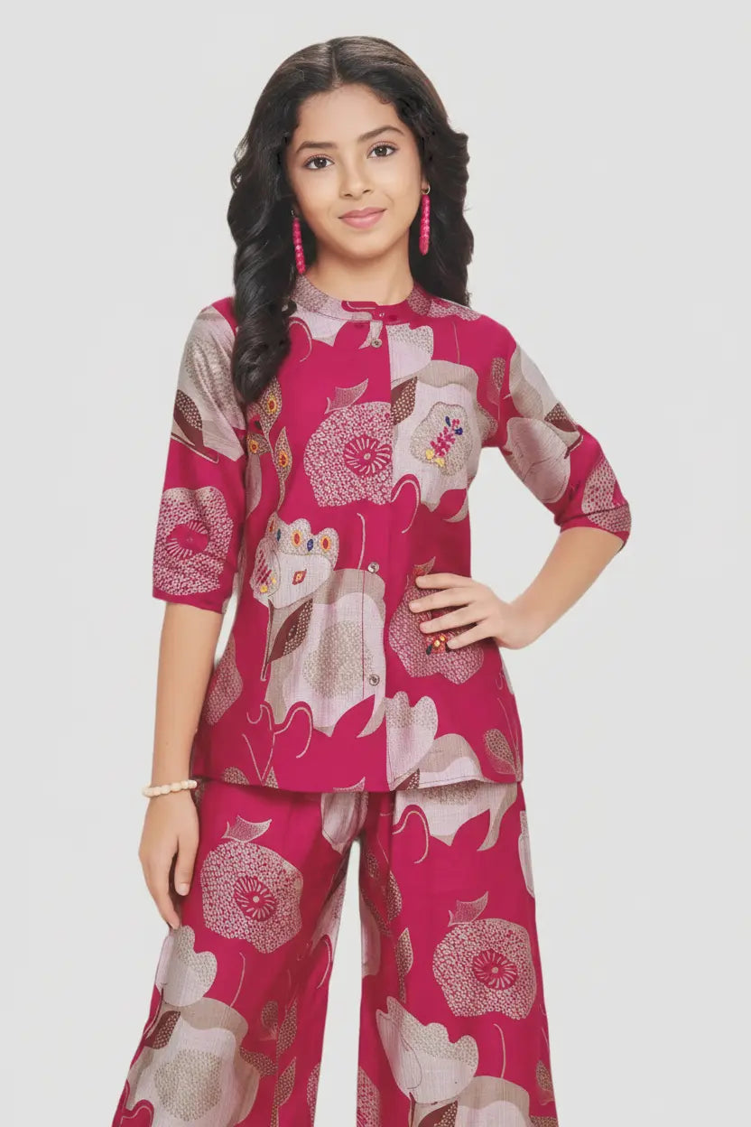 Young girl wearing a pink outfit with cat patterns on a white background