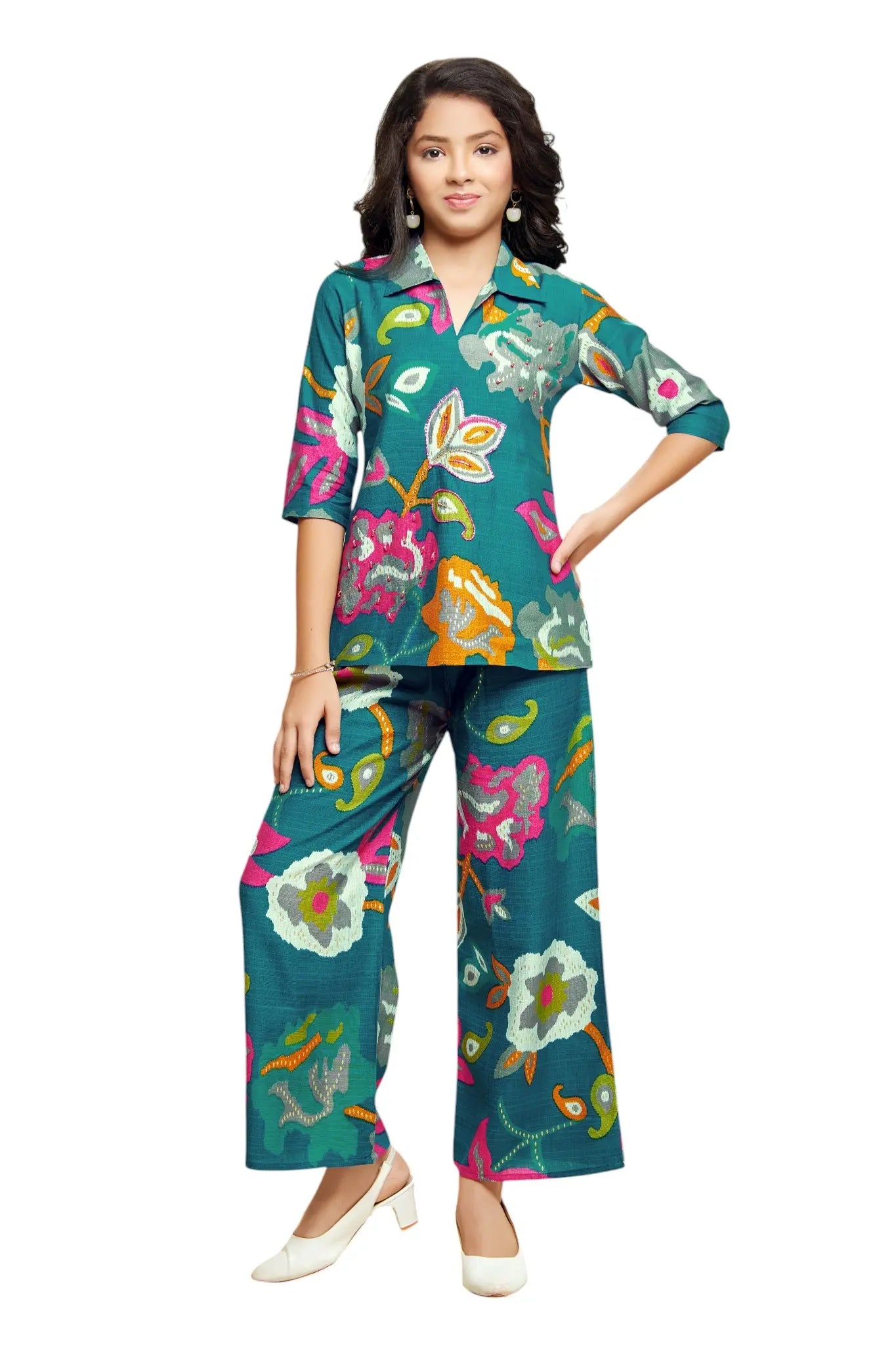 Woman wearing a colorful floral outfit on a white background