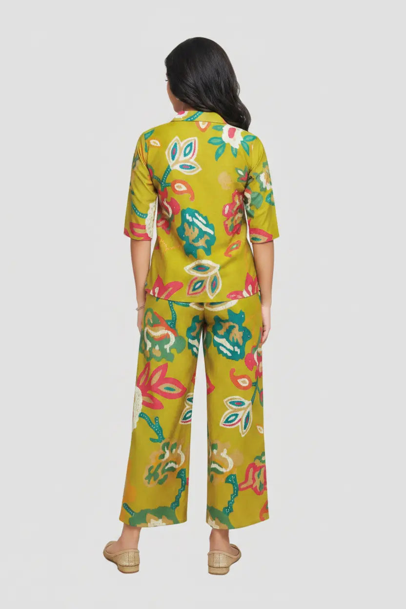 Woman wearing a colorful floral outfit on a white background