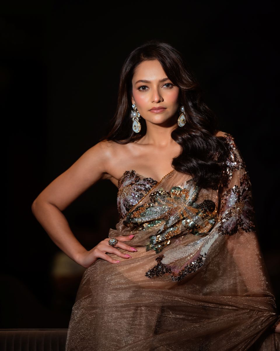 Woman in a sparkling dress with a dark background