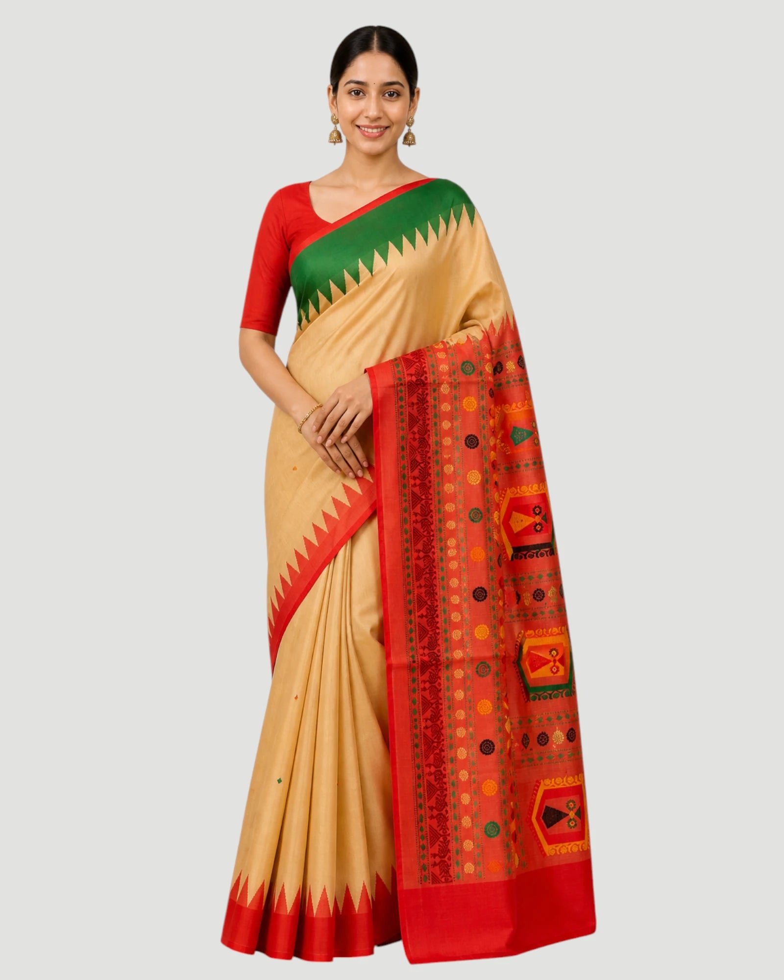 Woman wearing a traditional saree with a red and green border on a white background