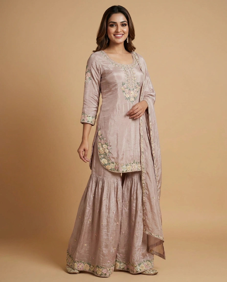Woman wearing a traditional outfit with floral embroidery on a beige background