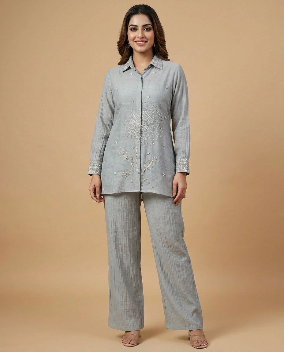 Woman wearing a gray checkered outfit on a beige background