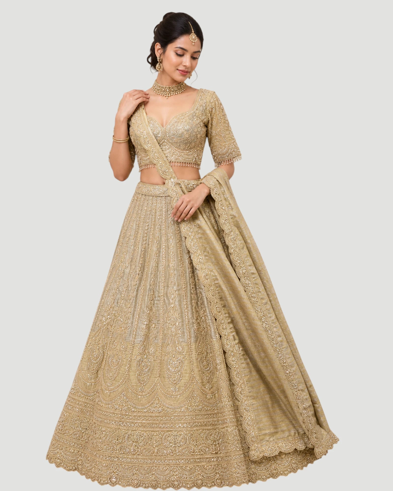 Beige embroidered traditional outfit on a plain background