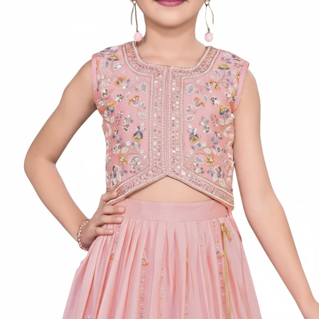 Pink embroidered top and skirt set on a white background