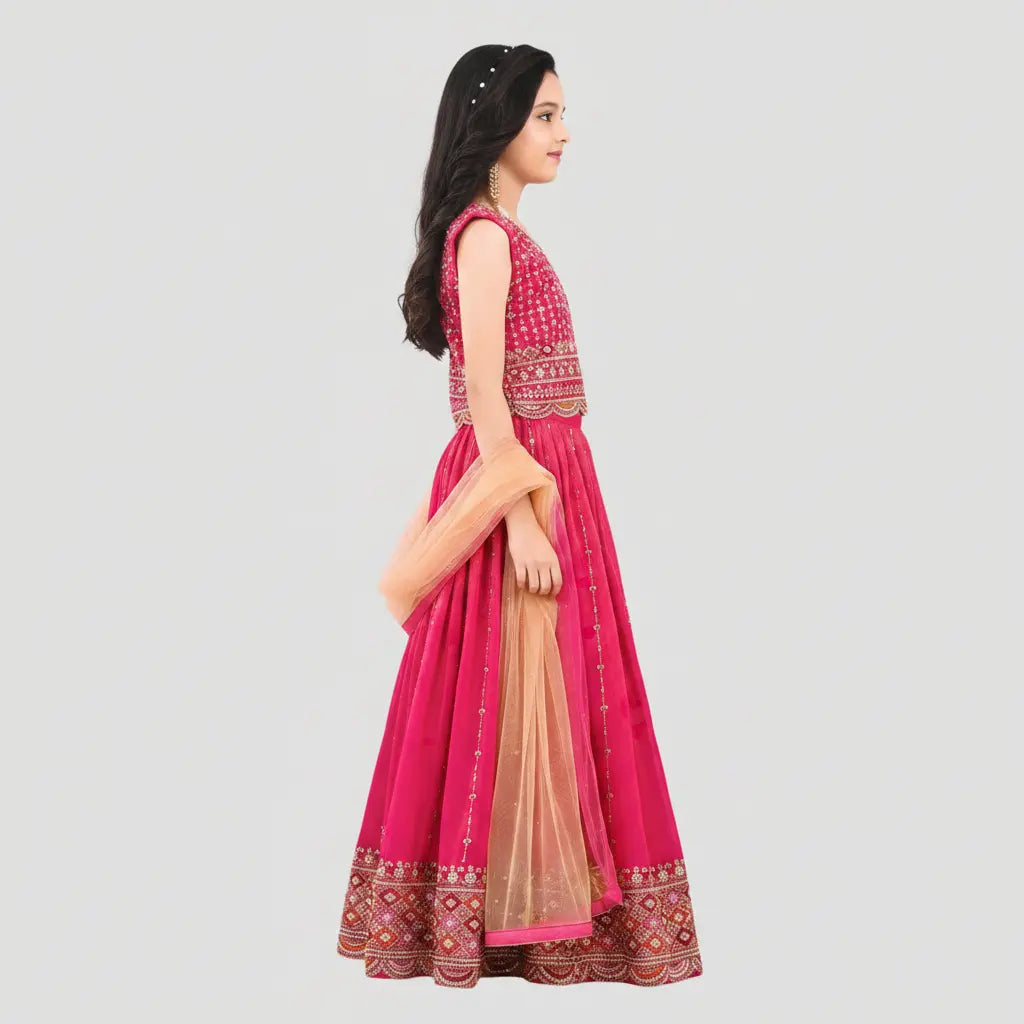 Woman wearing a pink traditional outfit with a beige dupatta on a light gray background