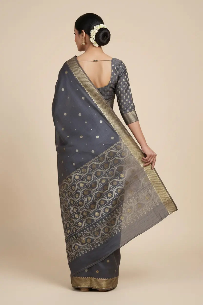 Woman wearing a traditional saree with a beige background