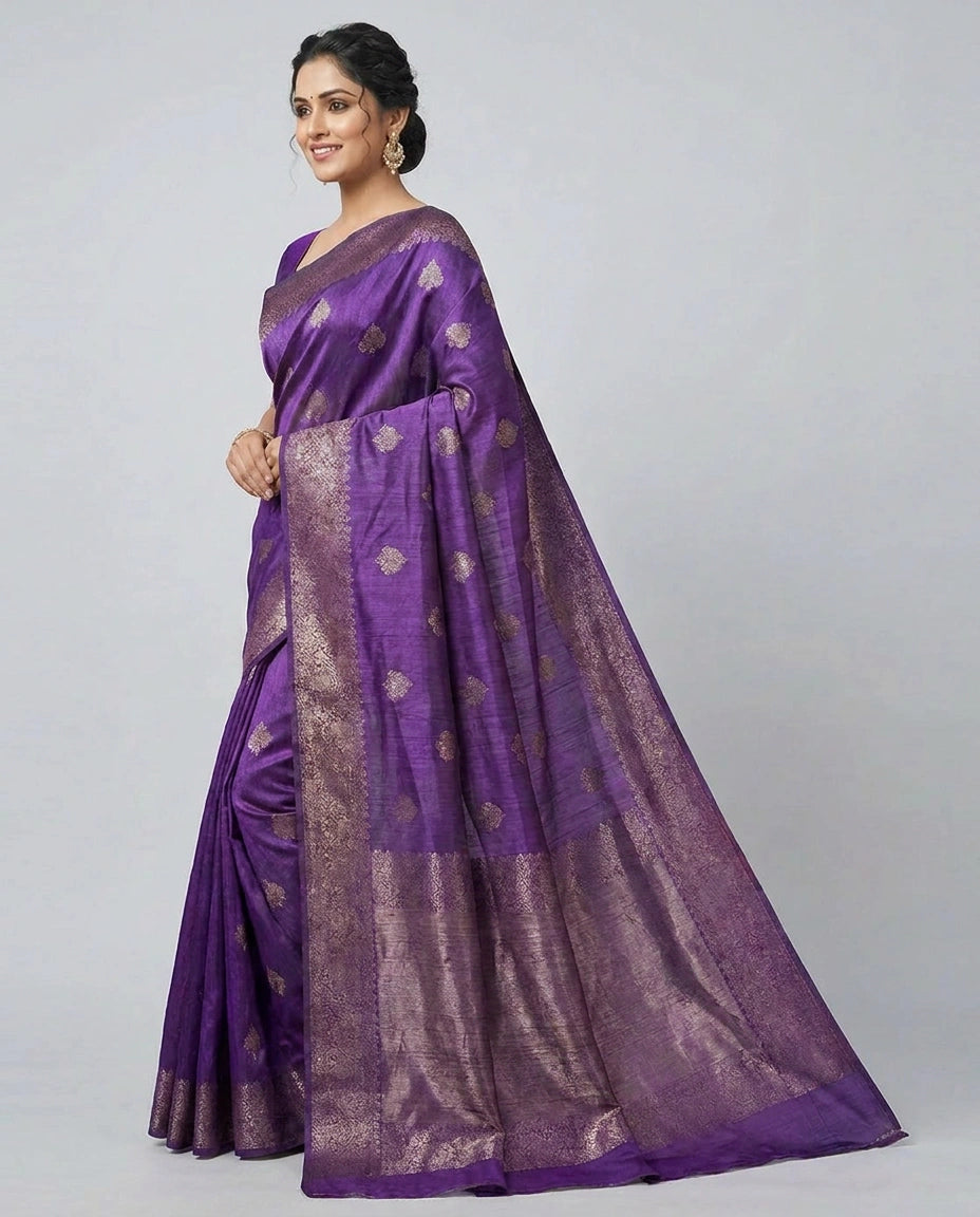 Woman wearing a purple saree with a white background
