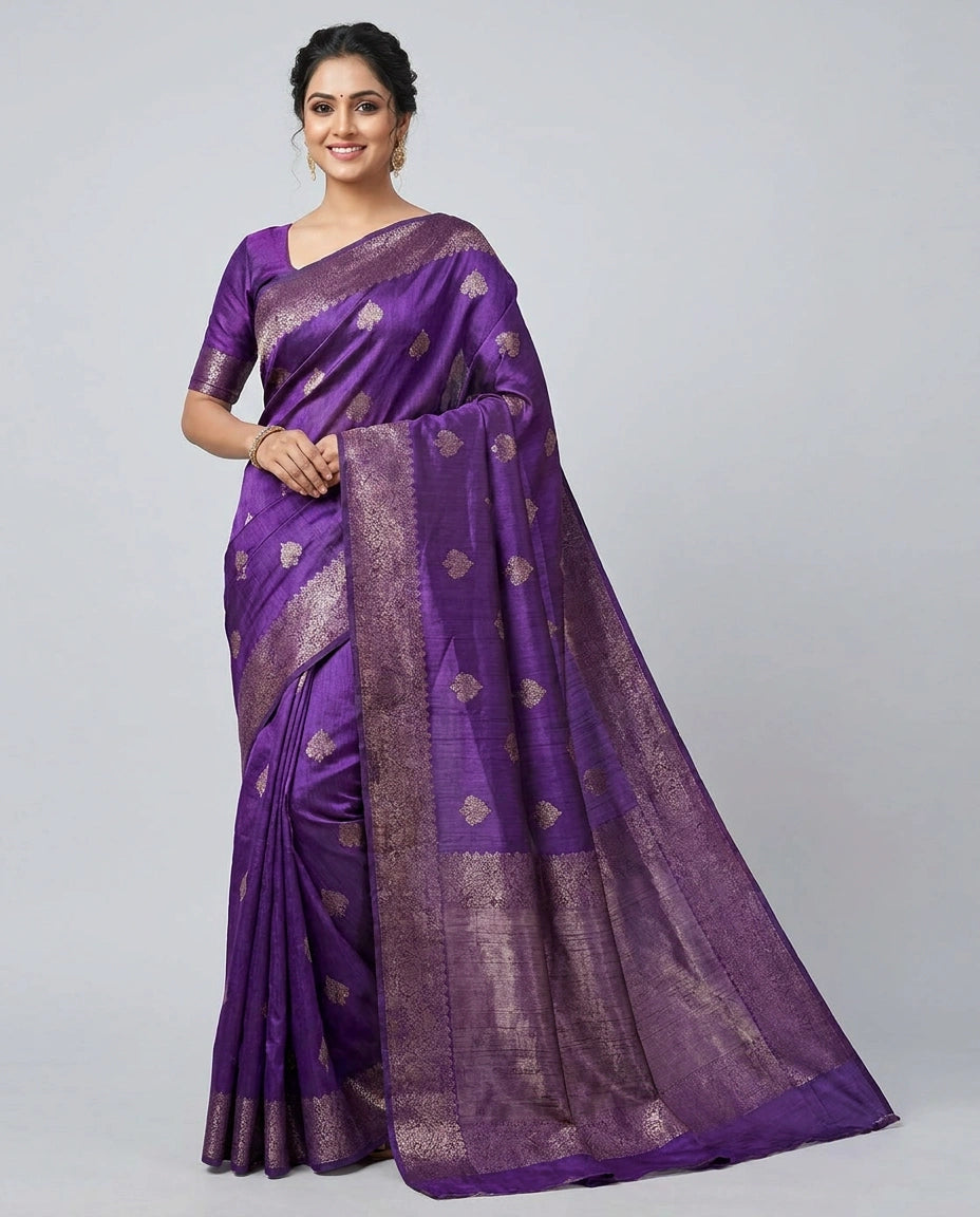 Woman wearing a purple saree with a white background