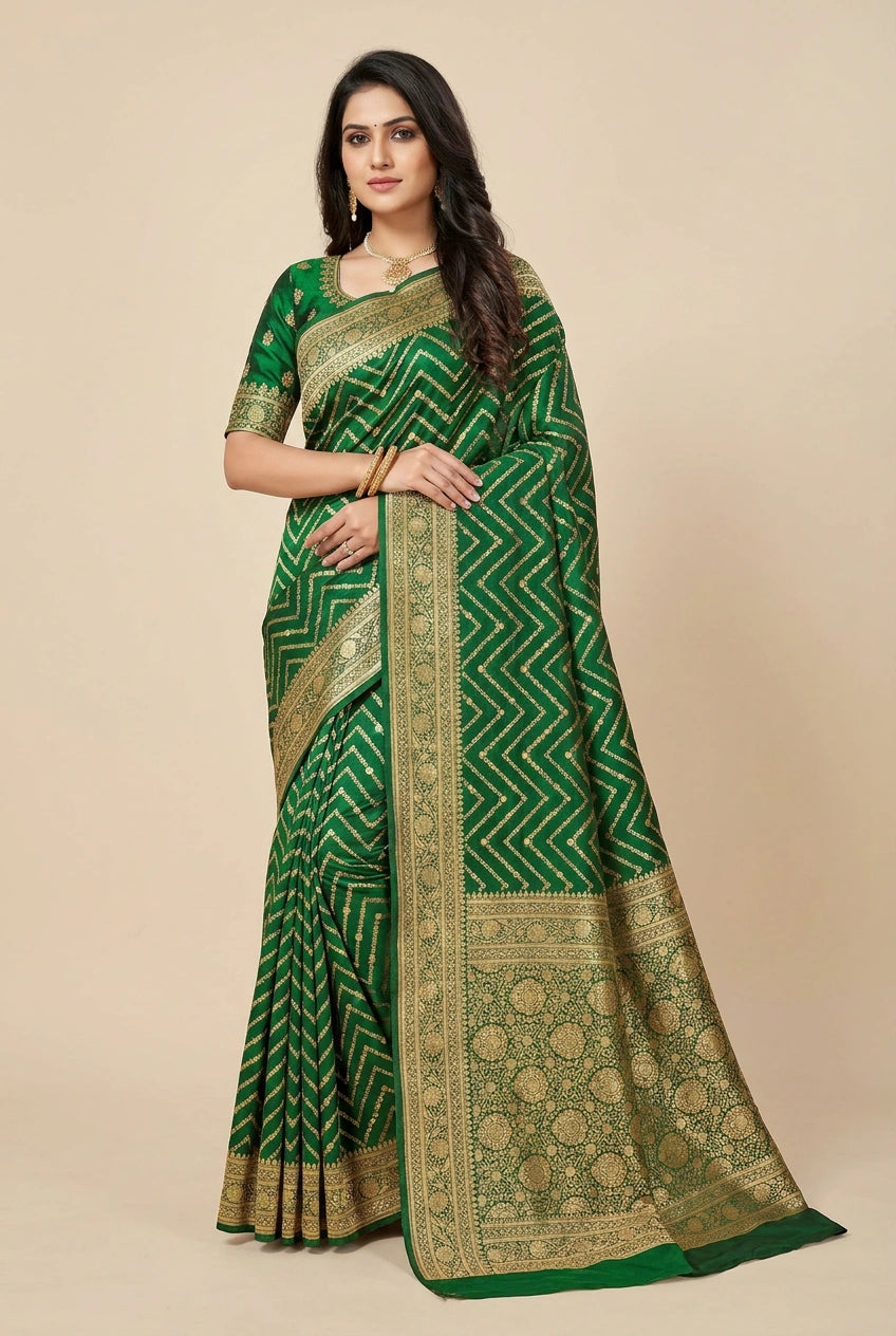 Woman wearing a green saree with gold patterns on a beige background