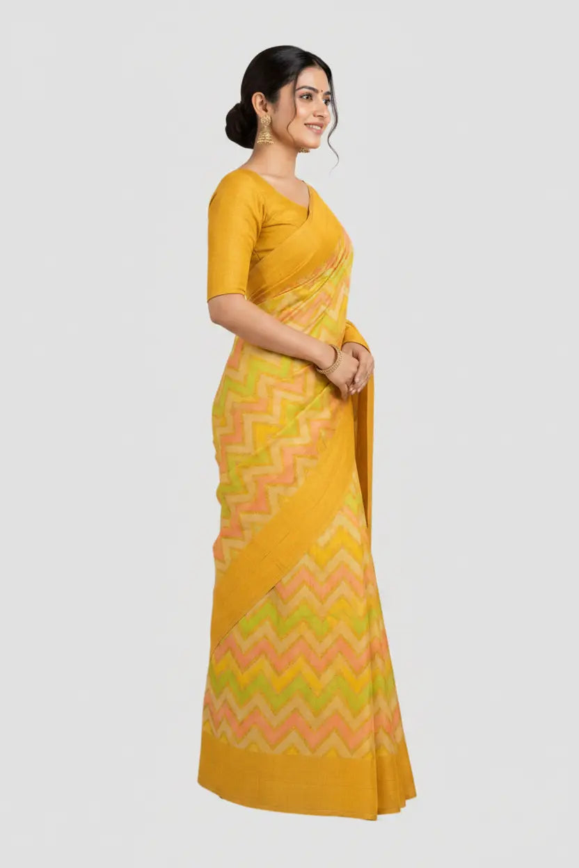 Woman wearing a yellow saree with a white background