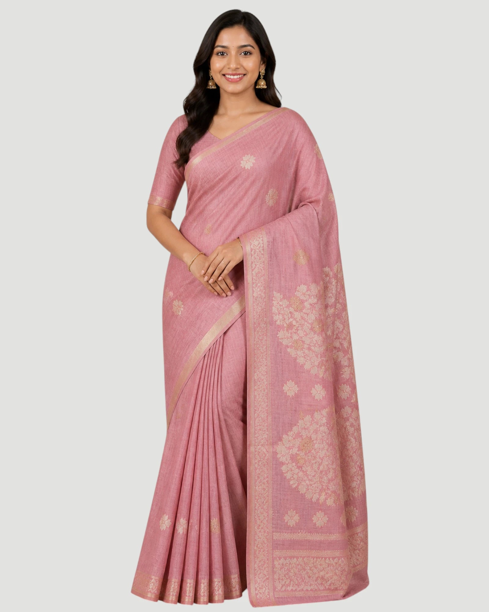 Woman wearing a pink saree with a white background