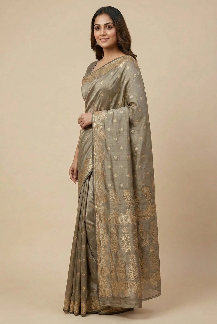 Woman wearing a traditional saree with a beige background